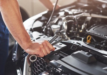 Mechanic Diagnosing Car Problem