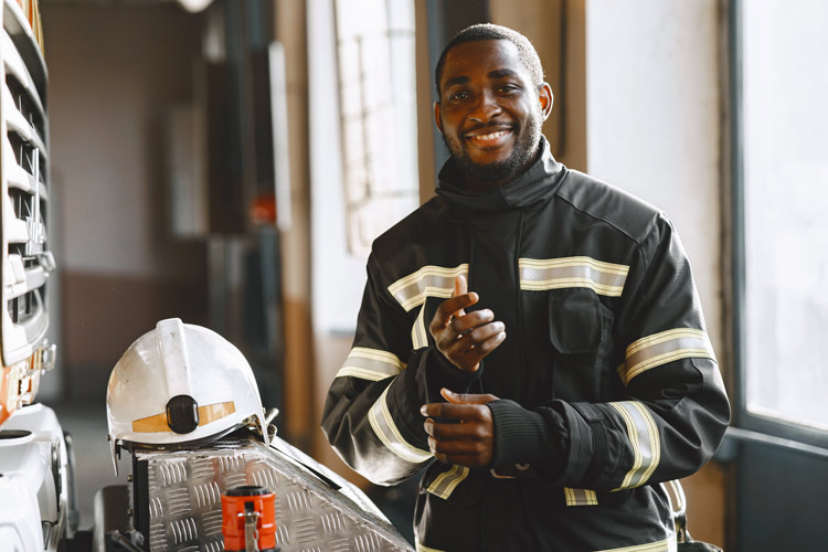 A firefighter smiling.